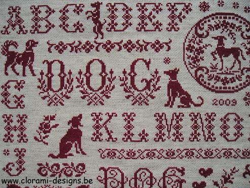 afbeelding van de rode kruissteek merklap Ref 024 Dog Sampler van CloRaMi Designs