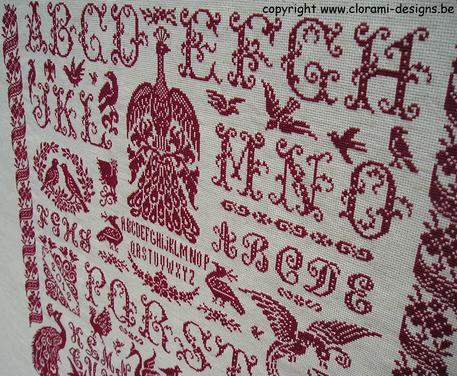 afbeelding van de rode kruissteek merklap Ref 034 Flying High Sampler van CloRaMi Designs